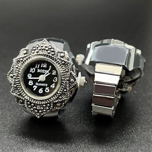 Silver vintage quartz finger watch with black dial and elastic metal band for unisex wear