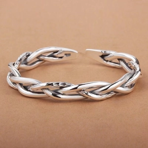 Vintage Thai silver twist bangle with minimalist braided design and open adjustable cuff