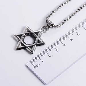Polished stainless steel hexagram pendant with ball chain necklace on a white background
