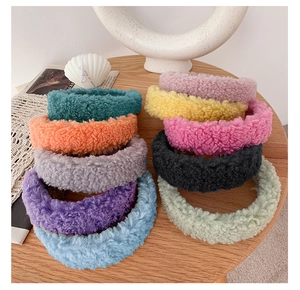 Detailed arrangement of soft teddy fleece headbands in ten different vibrant candy colors