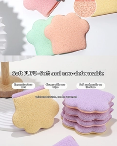 Macro detail of cat paw facial sponges with honeycomb pores showing water absorption