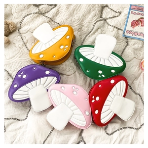 Detailed view of colorful mushroom-shaped PU leather crossbody bags with metal chains