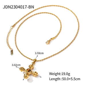 Close-up of 18k gold plated cross pendant with detailed size specifications and weight
