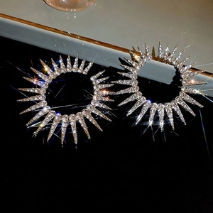 Sparkling oversized rhinestone spiked hoop earrings in silver for a glamorous fashion statement
