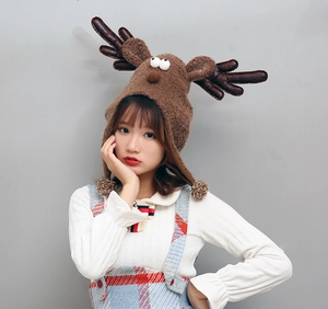 Plush brown reindeer hat for kids with 3D antlers, cute ears, and soft pom-pom earflaps