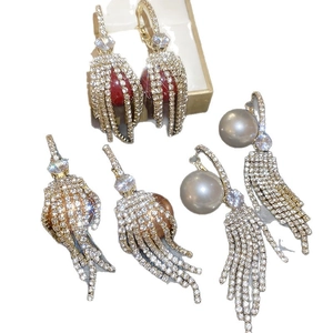 Elegant gold drop earrings with colorful pearls, sparkling rhinestones and long tassels