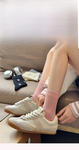 Pink mid-calf cotton socks featuring silver star patterns and cozy home styling