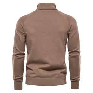 Detail view of the back seams and ribbed cuffs on this brown turtleneck knit sweater