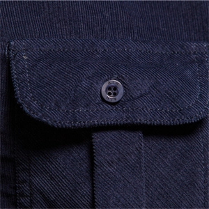 Men's navy blue corduroy shirt featuring a detailed pocket with engraved button closure