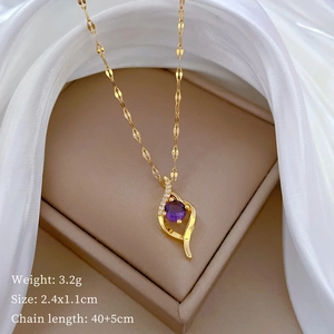 Detailed view of gold necklace with purple stone, 3.2g weight and 2.4x1.1cm dimensions