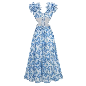 Detail of floral maxi dress with waist cut-outs, puff sleeves and a lace-up back design
