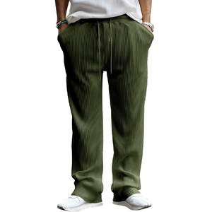 Detail view of army green corduroy pants with elastic waistband and drawstring design