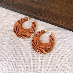 Brown leather-wrapped fan-shaped hoop earrings with gold-plated metal accents