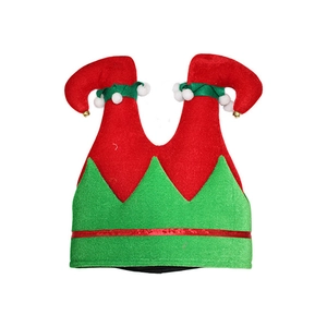 Detailed view of red and green festive elf hat with plush pompom and golden jingle bells