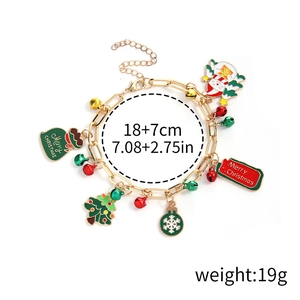 Detailed top view of Christmas charm bracelet with Santa, tree and bell pendants