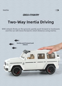 Close-up of white off-road toy car with inertia power system and rugged black tires