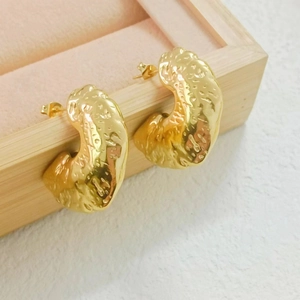 Retro 18K gold plated stainless steel hollow C-shape stud earrings on a wooden tray