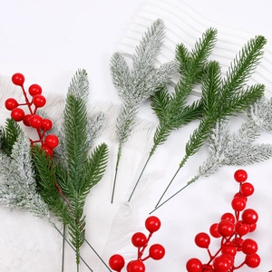 Artificial Christmas branches with red berries and frosted pine needles for DIY floral decor