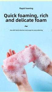 Detail of pink foaming net creating rich white bubbles for soap and facial cleanser