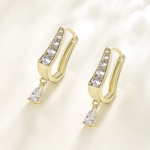 Elegant gold U-shaped huggie earrings with sparkling teardrop zircon pendants