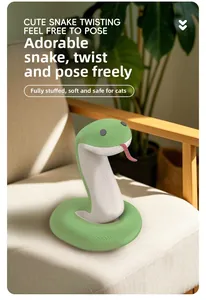 Detail of soft green plush snake cat toy with full filling on a beige sofa