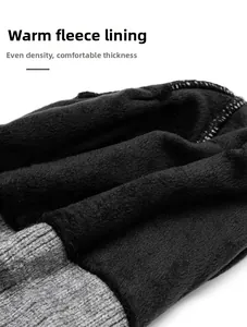 Detail view of the thick fleece lining and warm grey knit texture of the beanie