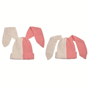 Detail view of pink and white contrast knit bunny ear beanie with premium stitching