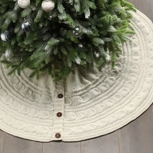Detailed knit texture of cream Christmas tree skirt with decorative wooden buttons
