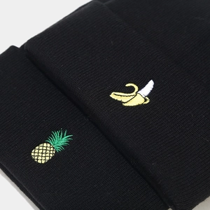 Classic black knitted beanie with fruit embroidery featuring pineapple and banana details