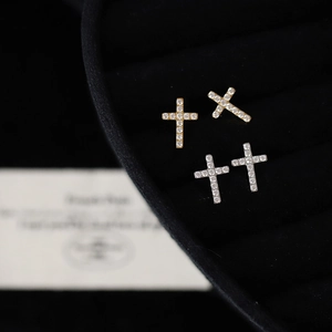Exquisite silver and gold cross stud earrings with cubic zirconia pavé in black velvet box