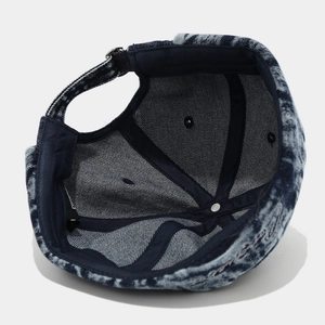Top view of retro washed denim skull cap with side embroidery and adjustable back strap