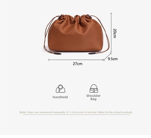 Detailed view of the 27x20x9.5cm waterproof brown drawstring liner bag for handbags