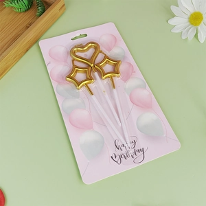 Candele di compleanno dorate a forma di cuore e stella con supporti bianchi