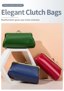 Three elegant first layer leather clutch bags in green, blue, and red on geometric props