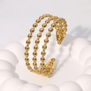Elegante bracciale rigido aperto a tre strati con perline geometriche dorate da donna