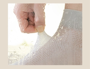Detailed view of breathable light grey mesh socks showing high elasticity and thin texture
