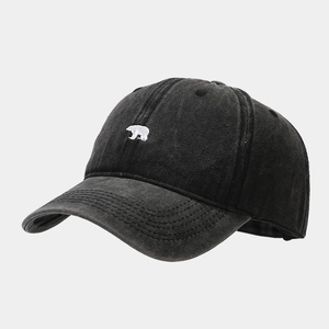 Close-up of polar bear embroidery on black washed vintage cotton baseball cap detail