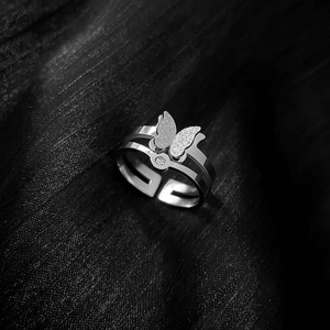Minimalist silver butterfly titanium steel ring with sparkling zircon on black silk