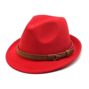 Classic red wool felt fedora hat with brown leather band and gold buckle on white background