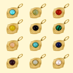 Set of twelve vintage gold stainless steel pendants with assorted colorful natural stones