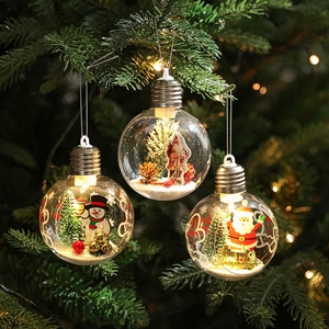 Three transparent LED Christmas tree ornaments with festive Santa and snowman scenes inside