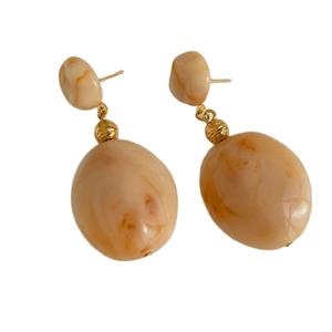 Vintage Maillard resin amber oval earrings with gold sphere accents on a white background