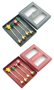 Detailed view of 4-piece gold stainless steel Christmas spoons and forks in gift boxes