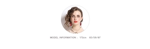 Close-up of elegant red flower earrings worn by a model against a white background