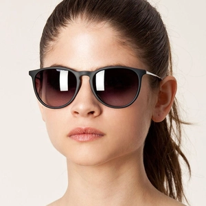 Kids oval frame sunglasses with matte black frames and gradient lenses for outdoor sun protection