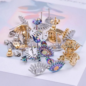 Detailed view of 304 stainless steel eye-shaped stud earrings in silver, gold and rainbow