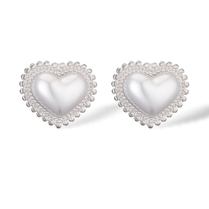Detail of silver heart stud earrings with white pearl inlay and lace textured edges