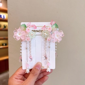 Detail of Hanfu hair clips featuring pink flower petals and pearls with long tassels