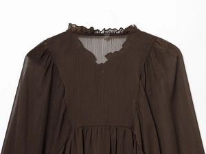 Detailed back view of dark brown chiffon blouse with layered ruffle collar and soft pleats