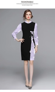 Dettaglio dell'abito Qipao con maniche in seta viola e ricami floreali di paillettes
